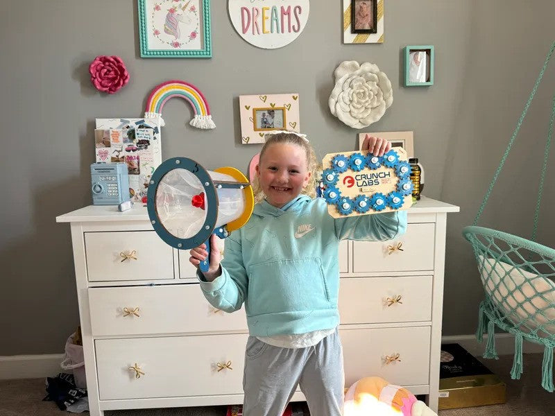 Photo of a Girl Playing with a Build Box in the her Bedroom