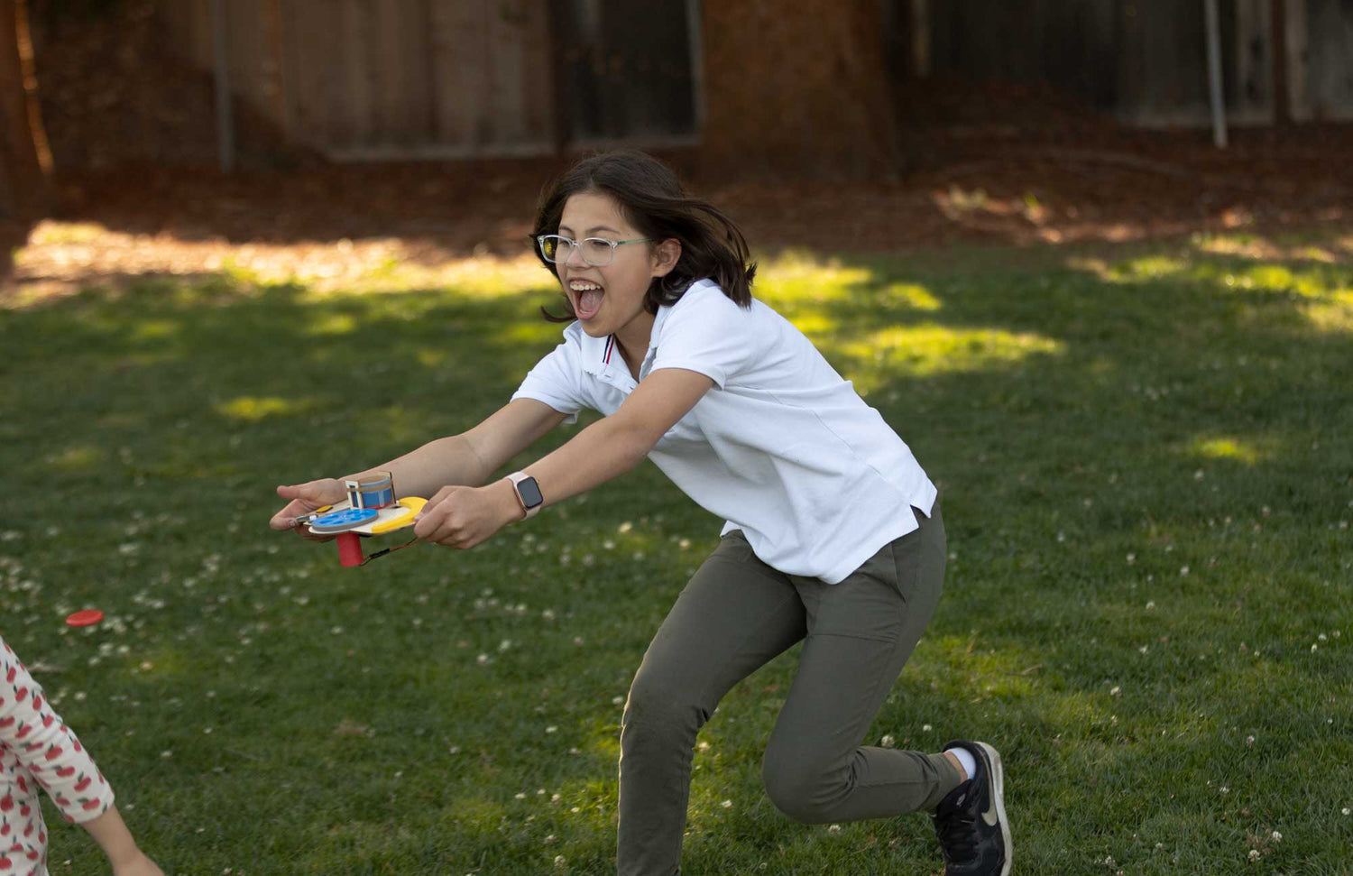 Girl Playing with Build Box Outside