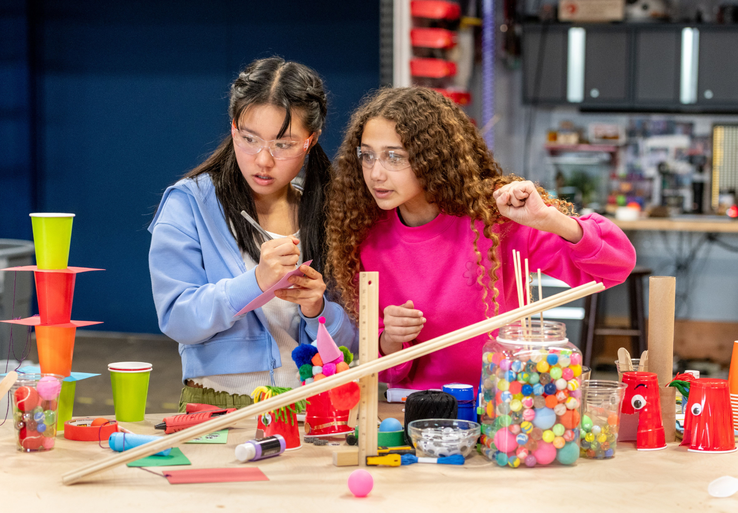 Photo of 2 Young Women Doing a Science Experiment at CrunchLabs